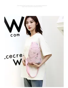 Stylish pink chest bag for women, casual printed sling cross body bag with wide strap.