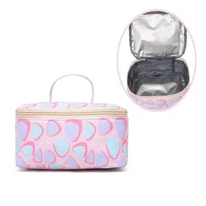 Pink insulated lunch bag with cute geometric pattern, portable cosmetic storage organizer.