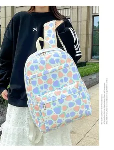 Detailed view of sweet style student backpack, cute pattern, large capacity, outdoor scene.