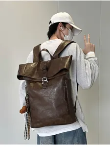 Detailed showcase of the stylish vintage brown PU leather roll-top backpack details.