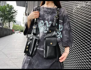 Detail view of stylish black PU leather tactical vest bag, multi-pocket streetwear chest rig.