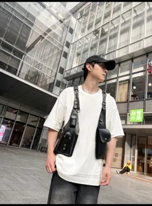 Men women black PU leather tactical harness bag, stylish chest rig vest bag for daily commute.