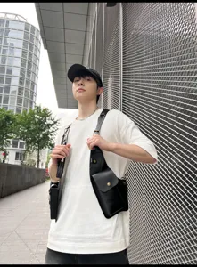 Black PU leather tactical chest bag, streetwear style vest bag, multi-pocket trendy design.