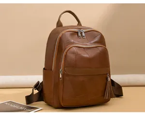 Retro braune Patchwork Leder Rucksack für Damen, lässige Pendler Schultasche mit Quaste.