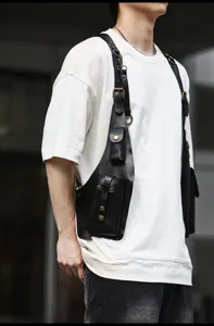 Close-up detail view of black PU leather tactical harness bag, stylish streetwear vest bag.