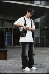 Stylish black PU leather tactical chest bag for men and women, modern street style.