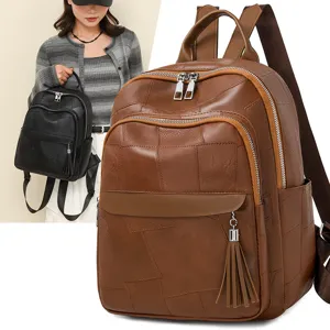 Damen Vintage braune Leder Rucksack große Kapazität lässig Pendler Schultasche mit Quaste Anhänger