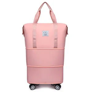 Uitbreidbare reisbagagetas met universele wielen en grote capaciteit in roze kleur.