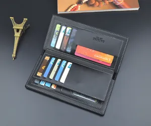 Interior detail of black leather long men's wallet with multiple card slots and pockets.