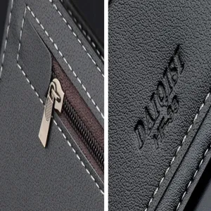Men's black soft leather wallet detail view featuring fine stitching and metal zipper hardware.