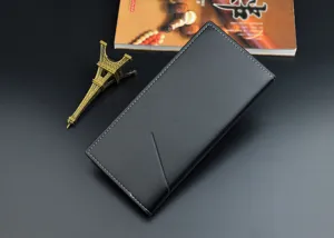 Detailed view of the black men long wallet showing fine leather texture and stitching craft.