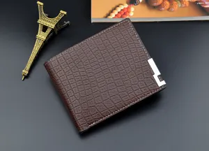 Men's short brown crocodile pattern leather wallet with metal corner decoration, multiple card slots.