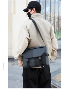 Detailed shot of the multi-functional waterproof black oxford cloth shoulder bag with buckles.