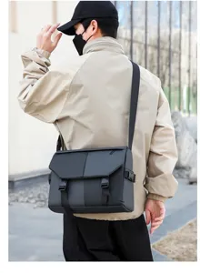 Messenger bag detail shot showing adjustable strap and durable oxford cloth material.
