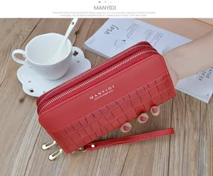 Women's long double zipper wallet with stylish crocodile pattern and convenient wrist strap design.