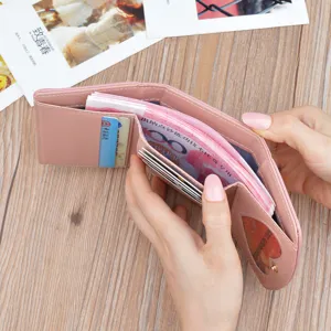 Women short pink wallet folding pu leather purse with card slots and cash compartment display.
