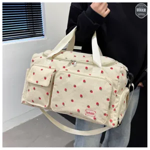 Corduroy strawberry travel bag with spacious capacity, tote handles and shoulder strap for gym and daily.