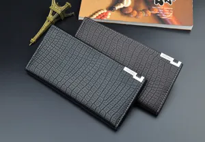 Detailed view of men's long crocodile pattern wallet with multiple card slots and soft leather.