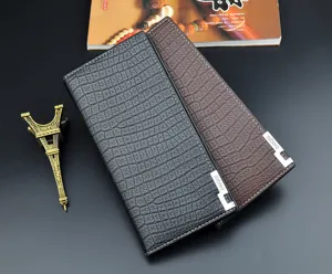 Men's long vertical crocodile pattern wallet detail view, soft leather business purse with metal corners.