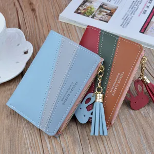 Women's short colorblock wallet with zipper tassel and cute rabbit pendant for daily use.