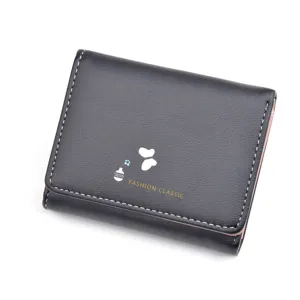 Compact black leather wallet for women with fold design, cute graphic print and multi card slots.
