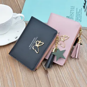 Women short wallet cute PU leather zipper coin purse with tassel pendant and butterfly charm.