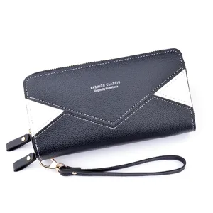 Portefeuille long noir et blanc contrasté à double fermeture éclair et dragonne pour femmes chic.