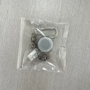 Retractable metal carabiner badge reel keychain with chain and clear strap clip detail