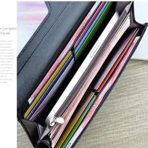 Portefeuille long noir pour femme avec fentes pour cartes poche zippée et emplacement téléphone.