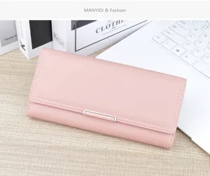 Detail view of the elegant pink long wallet, featuring soft leather texture and chic clasp.