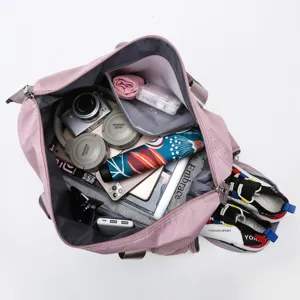 Bolsa de viaje grande impermeable con compartimento para zapatos y bolsillo.