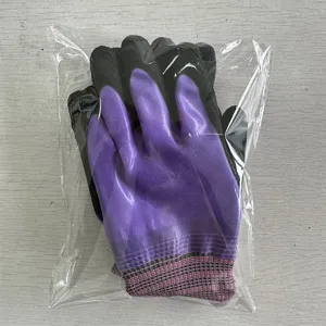 Detail view of small women's bird training bite-proof gloves with purple waterproof coating.