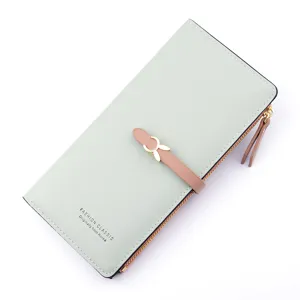 Elegant mint green long women's wallet with zipper closure, multi-card slots and stylish buckle.