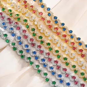Close-up detail of multi-colored cubic zirconia S-curve wave bracelets showing sparkling stones.