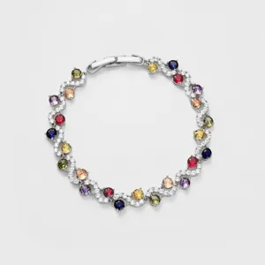 Close-up detail of luxury multi-color cubic zirconia cross tennis bracelet for women fashion.