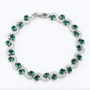 Elegant silver-tone green zircon wavy link bracelet for women, chic fashion party jewelry.