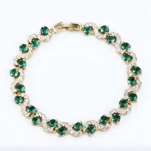 Elegant gold plated cross-curve green zirconia crystal bracelet for women fashion jewelry.