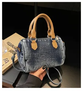 Vintage washed denim Boston handbag with brown PU leather handles and crossbody strap.