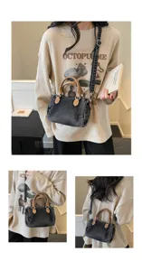 Vintage washed denim Boston bag for women, casual commuter handbag with shoulder strap.