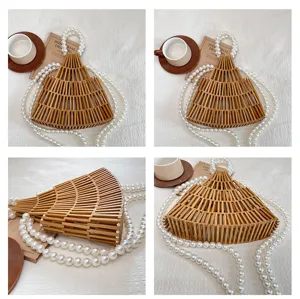 Borsa in bambù intrecciato a mano con manico di perle, design traforato, elegante borsa estiva.