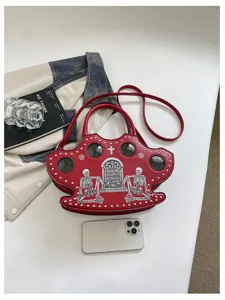 Red PU leather gothic style skull handbag with tombstone print and metal studs for women.
