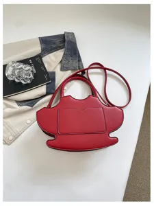 Red unique shape shoulder bag detail, stylish women crossbody purse with front pocket.
