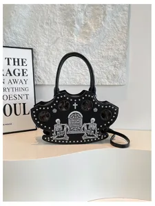 Gothic skull handbag detail view, featuring unique tombstone embroidery and rivet studs.