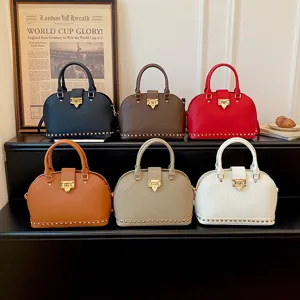 Klassieke koepel handtas voor dames, elegante schoudertas met metalen slot en hengsel.