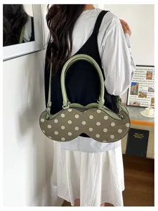 Unique polka dot shoulder bag for women, stylish niche design handbag, trendy daily commuter bag.