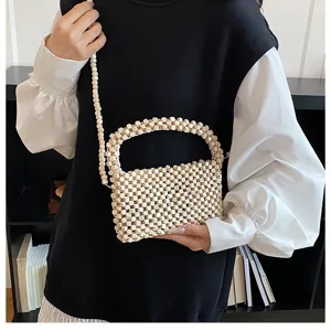 Borsa a tracolla chic in perline di legno da donna, borsa estiva da spiaggia cava fatta a mano.