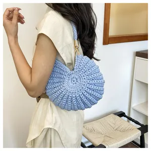 Handmade crochet conch shell shoulder bag detail view, casual chic daily accessory.