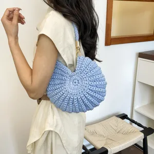 Handcrafted blue conch shell woven shoulder bag for women, stylish beach underarm crossbody handbag.