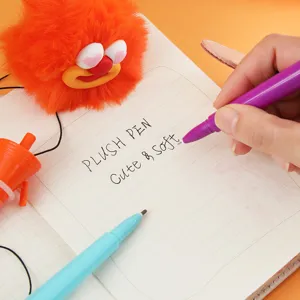 Detailed close-up of a cute fluffy monster plush pen with vibrant orange design for students.