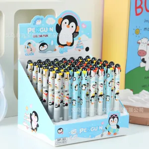 Close-up detail of cute cartoon penguin gel pen display box showing organized 0.5mm black ink pens.